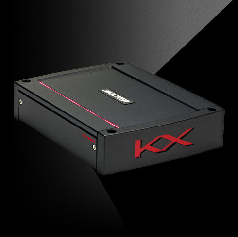 Angled view of KICKER KXA1200.1 amplifier with black housing, red accent line, and side KX logo.