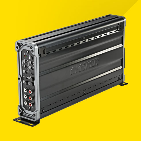 Side view of vertically mounted KICKER CXA660.5 car amplifier showing control panel and RCA inputs.