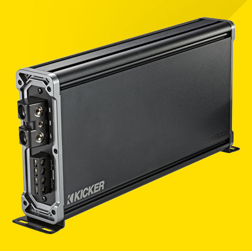 Angled side view of KICKER CXA1800.1 car amplifier showing power and speaker terminals.