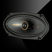 KICKER KS-Series 4x10-inch coaxial speaker with a black cone and orange accent ring, designed for powerful, detailed sound.