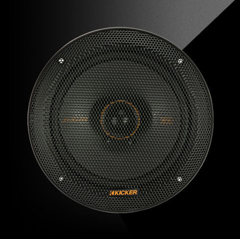Close-up of a KICKER KS-Series 6.5-inch coaxial car speaker with a black grille and orange accent ring.